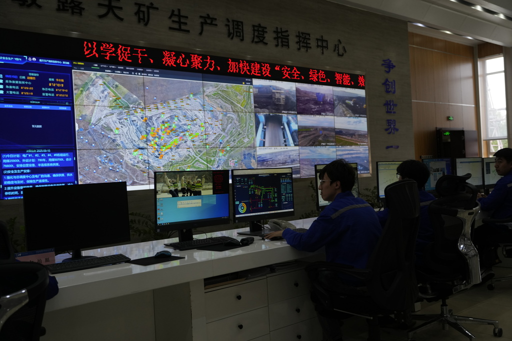A control center monitor autonomous mining truck operations in the Huaneng Yimin open-pit coal mine in Hulunbuir in northern China's Inner Mongolia province China, Monday, Sept. 15, 2025. (AP Photo/Ng Han Guan)