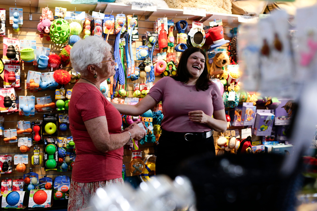 Rep. Haley Stevens, D-Mich., shops at the Decadent Dogs pet store with owner, Roxanne Leder, in South Haven, Mich., on Tuesday, July 7, 2026. (AP Photo/Kristen Norman)