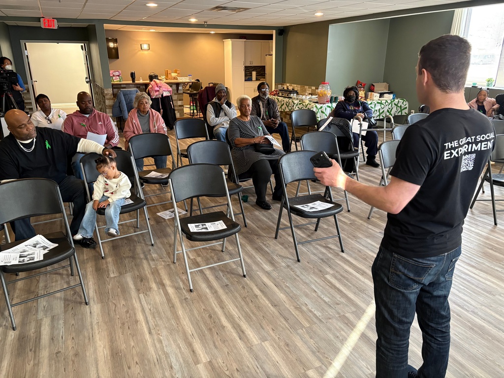 David Krissman, right, talks about harnessing social media and other efforts help find a kidney for Ahmad Collins, far left, in Harrisburg, Pa., on Saturday, Dec. 13, 2025. (AP Photo/Mark Scolforo)