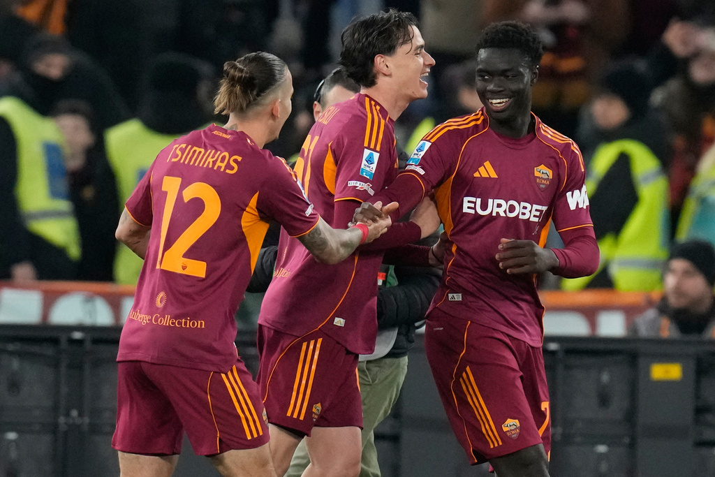 Roma players celebrate after a goal during the Serie A soccer match between Roma and Lecce in Rome, Sunday, March 22, 2026. (AP Photo/Gregorio Borgia)