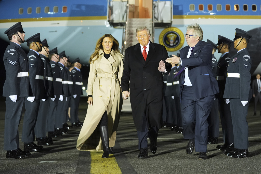 President Donald Trump and first lady Melania Trump are greeted by The Viscount Hood, Lord-in-Waiting, center-right, as they arrive at Stansted Airport near London, Tuesday, Sept. 16, 2025. (AP Photo/Evan Vucci)