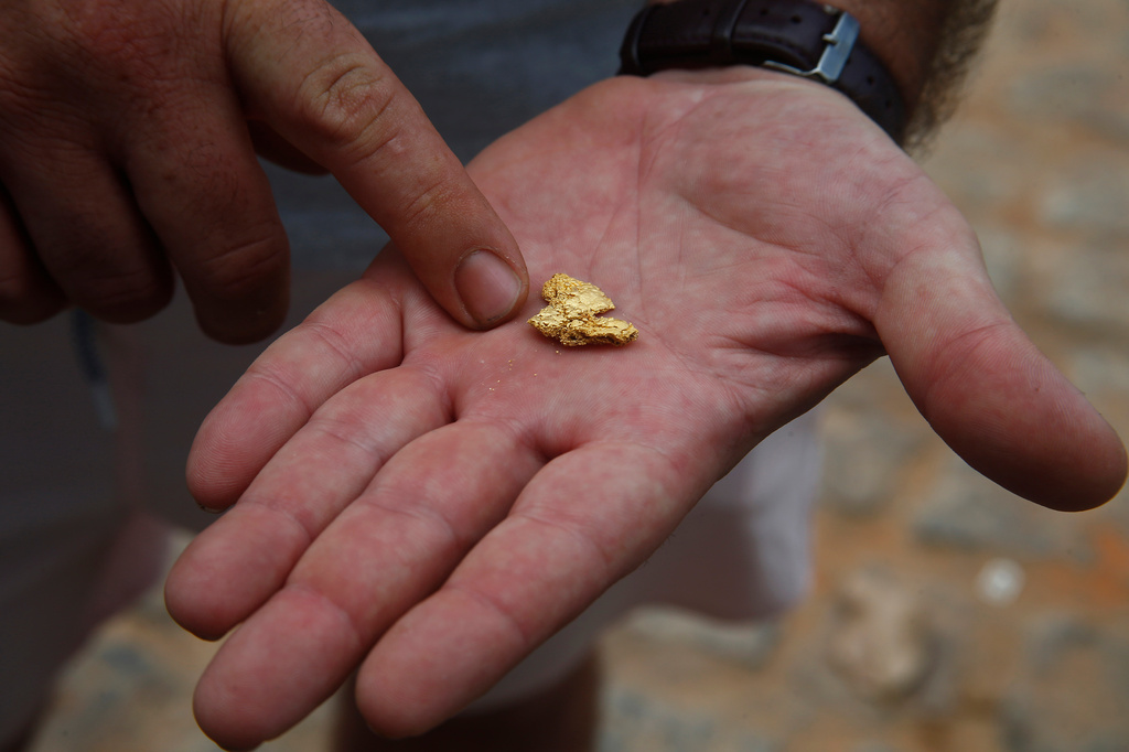 FILE - An airplane pilot who works in illegal mining shows gold illegally extracted from Yanomami Indigenous territory, in Alto Alegre, Roraima state, Brazil, Feb. 7, 2023. (AP Photo/Edmar Barros, File)