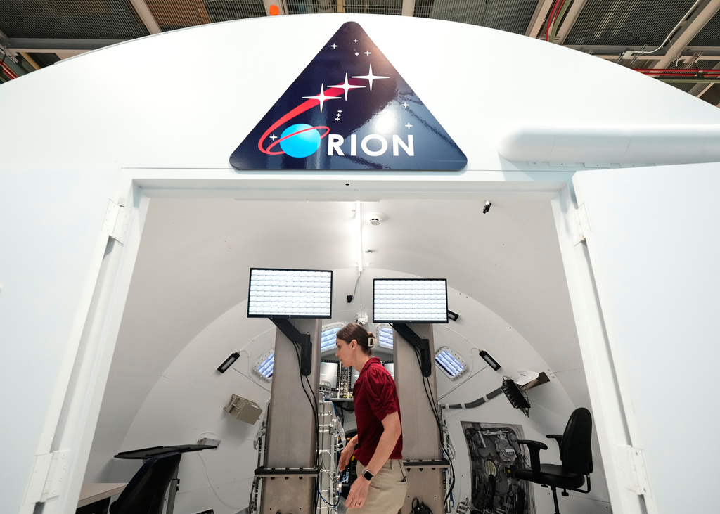 Jacki Mahaffey, chief training officer for Artemis II, prepares for a training mission in the Orion Mission Simulator at Johnson Space Center on Friday, July 25, 2025, in Houston. (AP Photo/Ashley Landis)