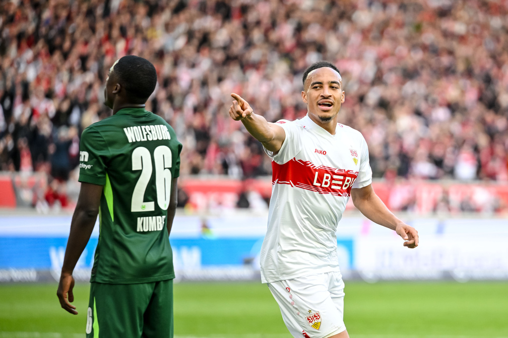 Stuttgart's Jamie Leweling, right, celebrates after scoring during the German Bundesliga soccer match between VfB Stuttgart and VfL Wolfsburg in Stuttgart, Germany, Sunday, March 1, 2026. (Harry Langer/dpa via AP)
