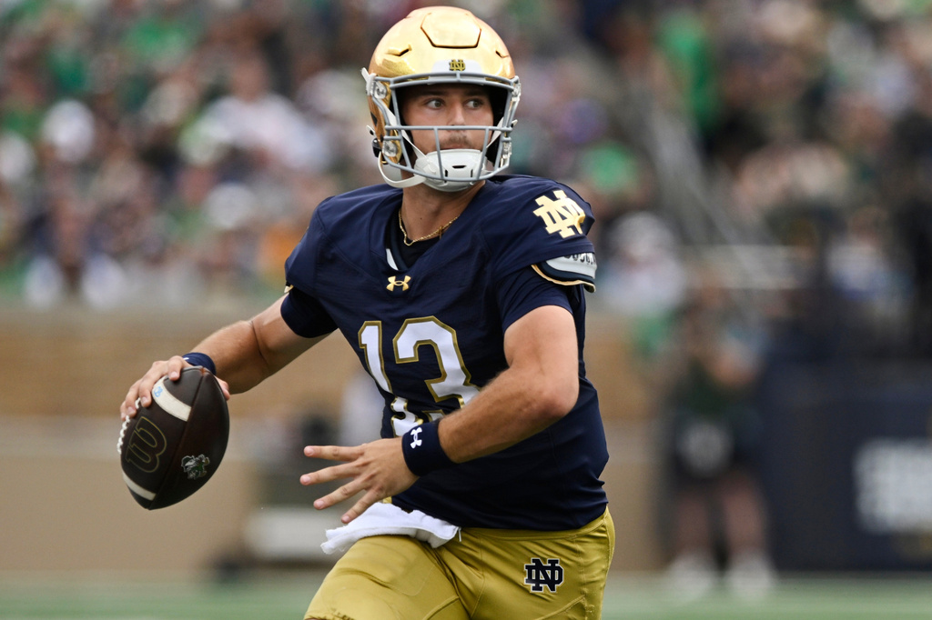 FILE - Notre Dame quarterback CJ Carr looks to throw during the first quarter of an NCAA football game against Purdue, Saturday, Sept. 20, 2025, in South Bend, Ind. (AP Photo/Paul Beaty, File)