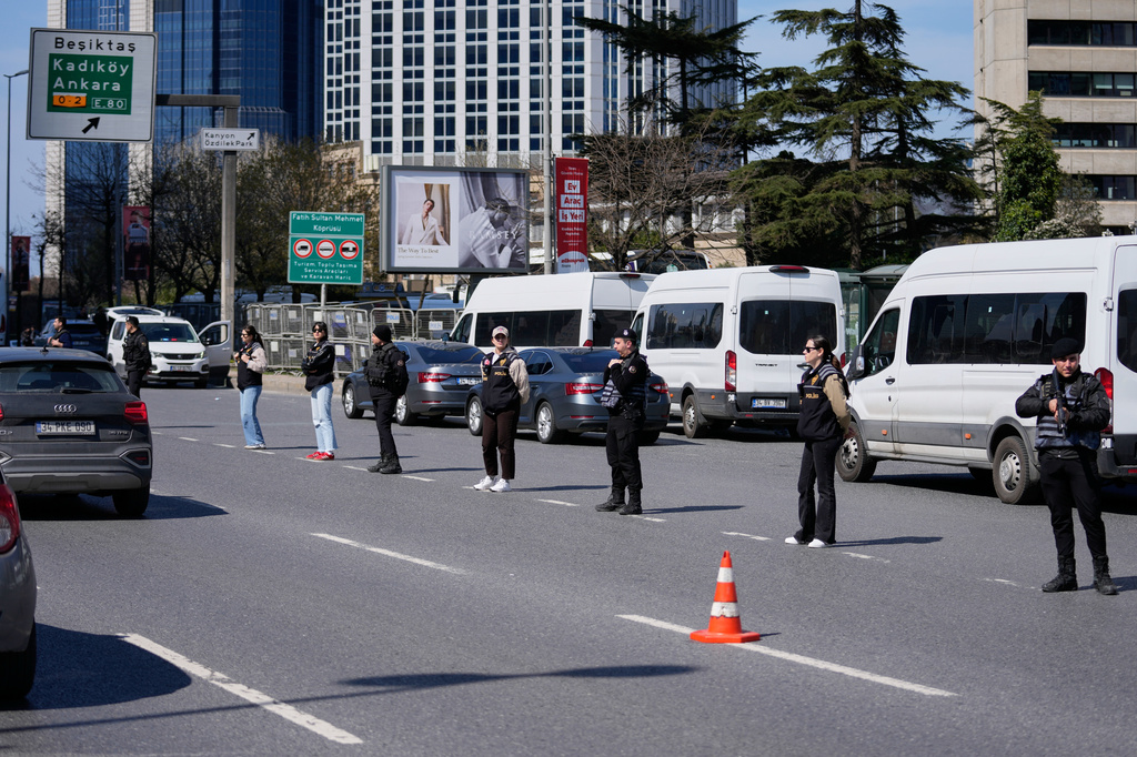 Turkish police secure the area after a gunmen attack at a building housing the Israeli Consulate in Istanbul, Turkey, Tuesday, April 7, 2026. (AP Photo/Khalil Hamra)