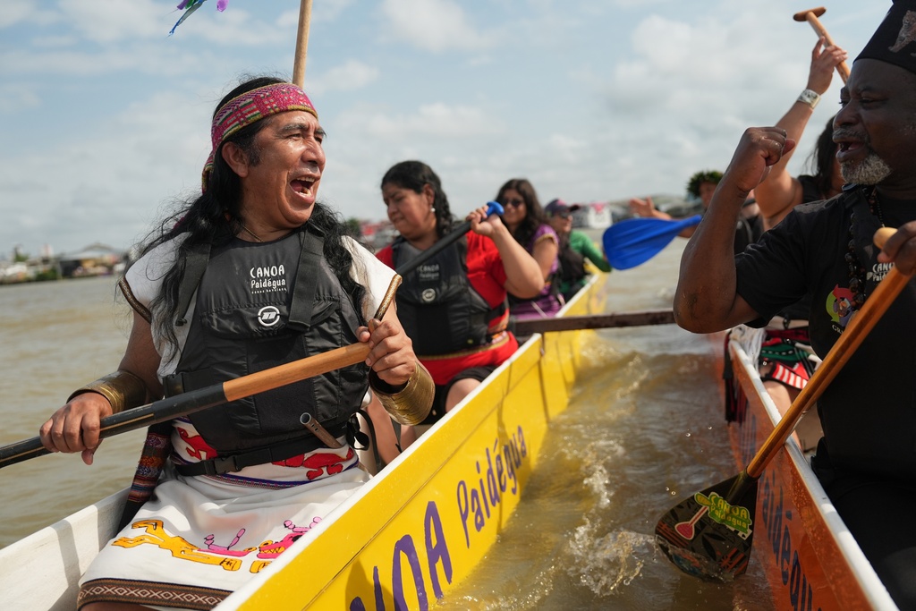 Indigenous peoples participate in the People's Summit event, on Guajara Bay during the COP30 U.N. Climate Summit, Wednesday, Nov. 12, 2025, in Belem, Brazil. (AP Photo/Joshua A. Bickel)