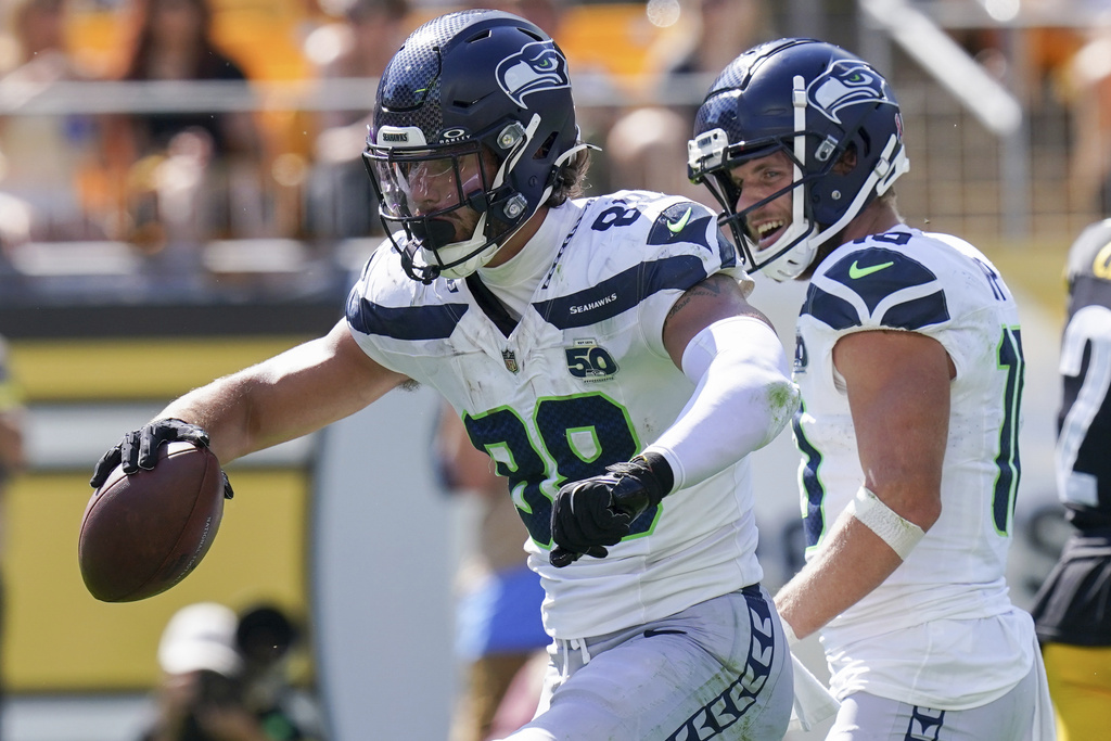 Seattle Seahawks tight end AJ Barner (88) celebrates after scoring a touchdown during the second half of an NFL football game against the Pittsburgh Steelers, Sunday, Sept. 14, 2025, in Pittsburgh. (AP Photo/Matt Freed)