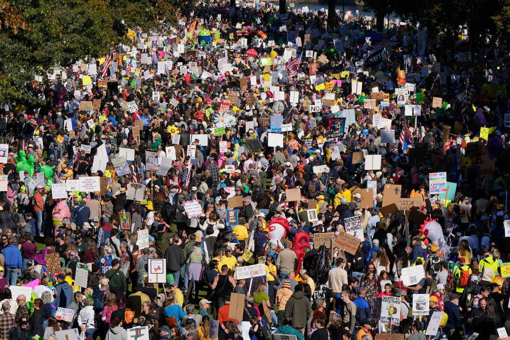 People march during a "No Kings" protest Saturday, Oct. 18, 2025, in Portland, Ore. (AP Photo/Jenny Kane)