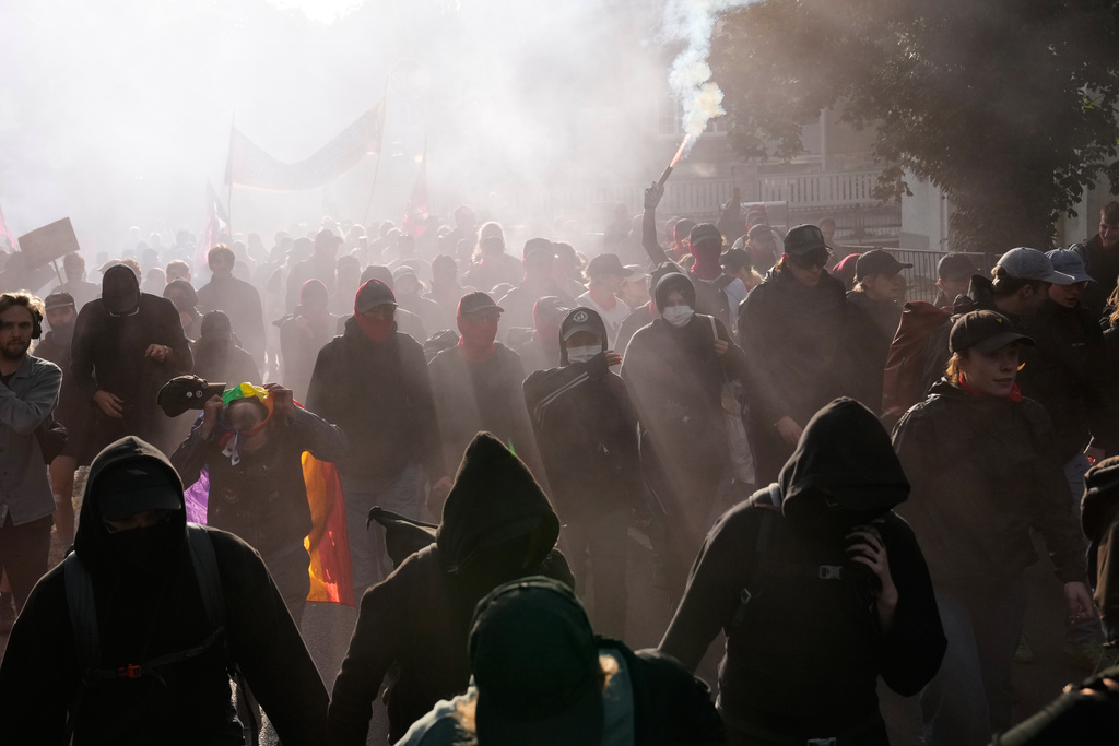 Protesters gather before a party convention of Alternative for Germany, or AfD in Erfurt, Germany, Saturday, July 4, 2026. (AP Photo/Ebrahim Noroozi)