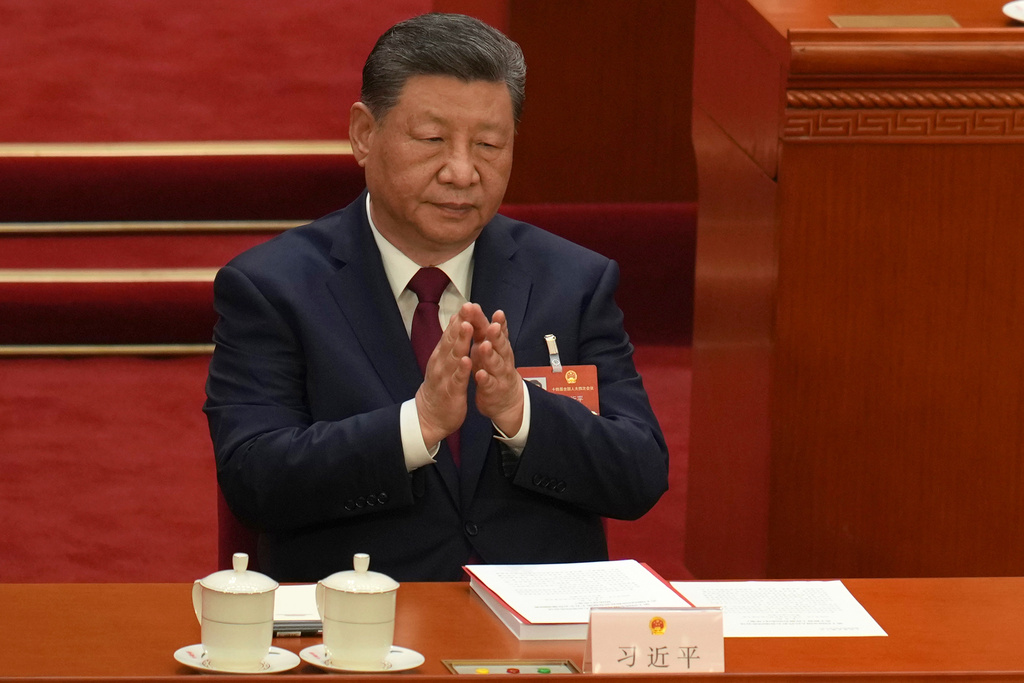 Chinese President Xi Jinping applauds during the closing session of the National People's Congress (NPC) at the Great Hall of the People in Beijing, Thursday, March 12, 2026. (AP Photo/Ng Han Guan)