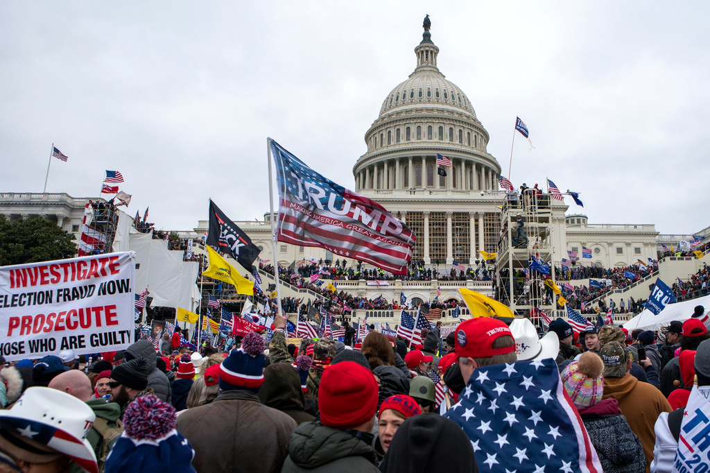 FILE - Rioters loyal to President Donald Trump rally at the U.S. Capitol in Washington, Jan. 6, 2021. (AP Photo/Jose Luis Magana, File)