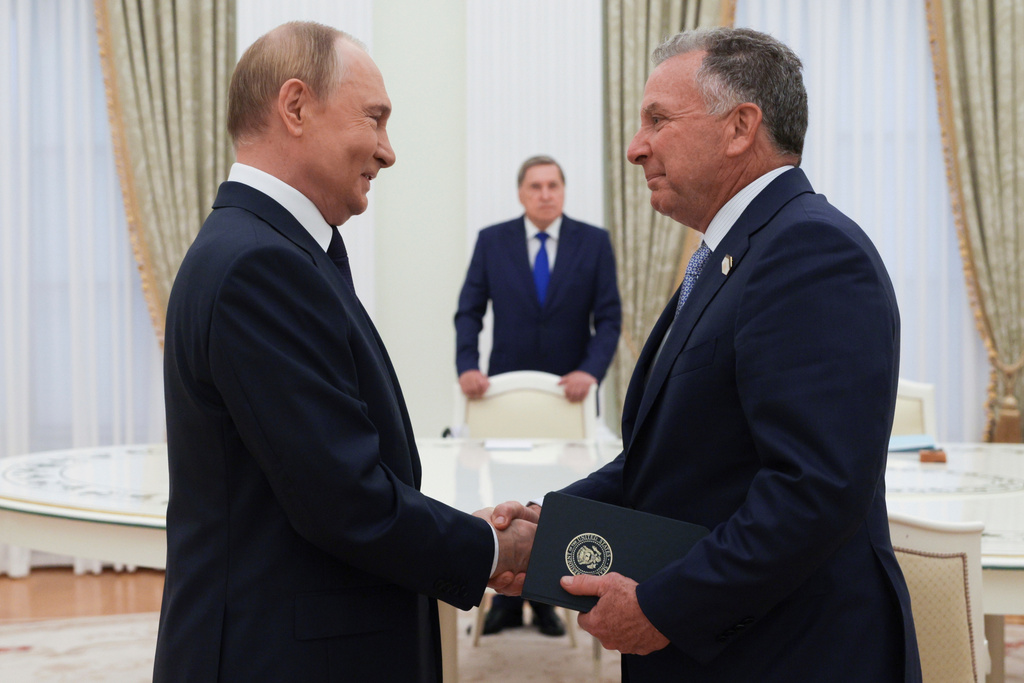 FILE - Russian President Vladimir Putin and U.S. President Donald Trump's special envoy Steve Witkoff shake hands during their meeting at the Kremlin, in Moscow, on Aug. 6, 2025. (Gavriil Grigorov, Sputnik, Kremlin Pool Photo via AP, File)
