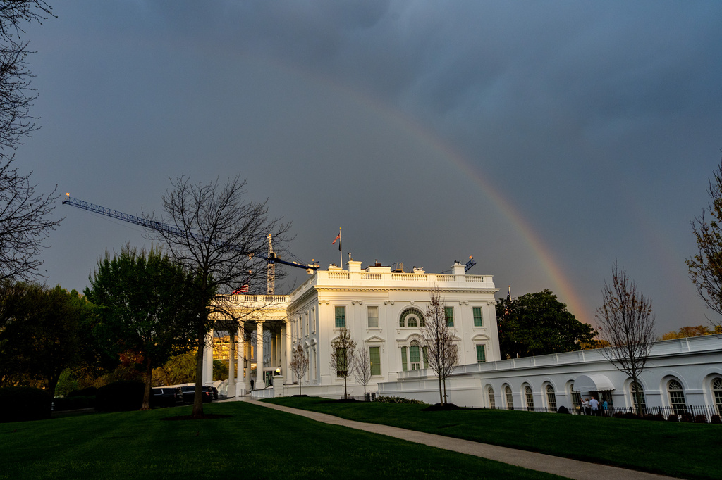 A rainbow forms over the White House on Wednesday, April 1, 2026, in Washington. (AP Photo/Alex Brandon)
