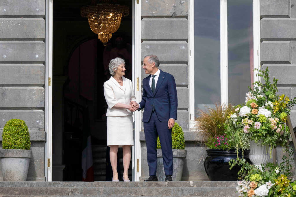 President of Ireland Catherine Connolly, left, and Canadian Prime Minister Mark Carney, right, during a visit to Westport House in Westport, Ireland, Sunday, June 14, 2026. (Andrew Downes/PA via AP)