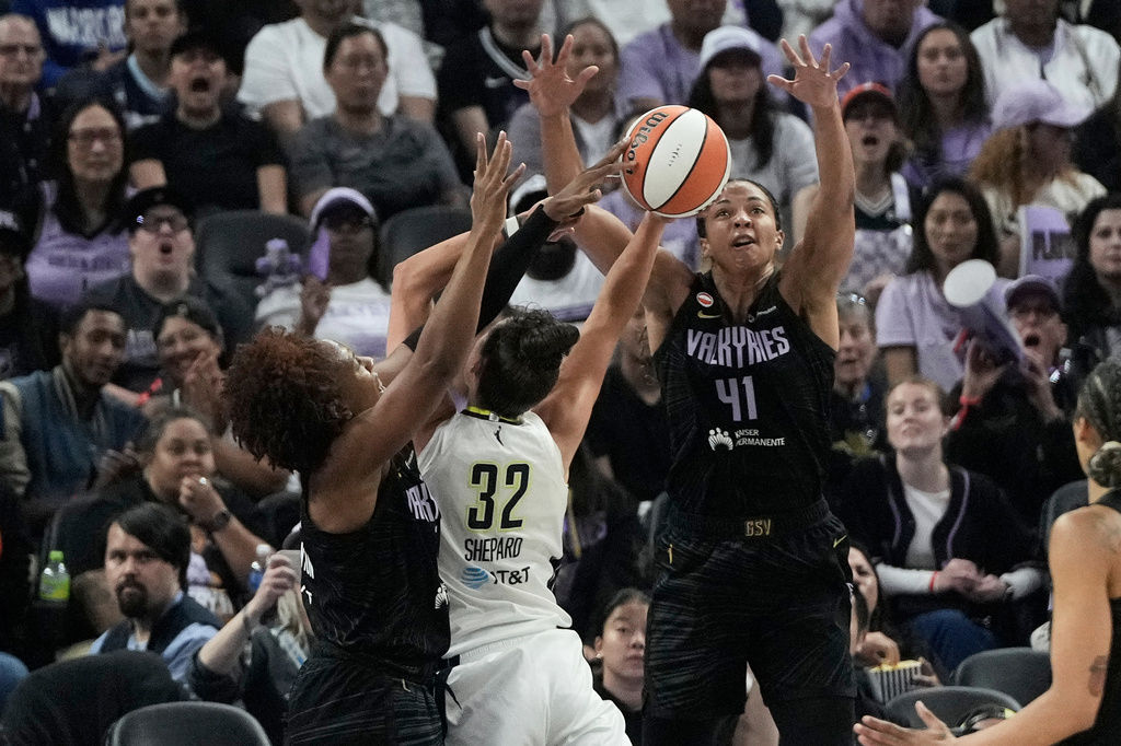 Golden State Valkyries forward Kayla Thornton, left, blocks a shot by Dallas Wings forward Jessica Shepard (32) and center Kiah Stokes (41) defends during the first half of a WNBA basketball game in San Francisco, Monday, Aug. 17, 2026. (AP Photo/Jeff Chiu)