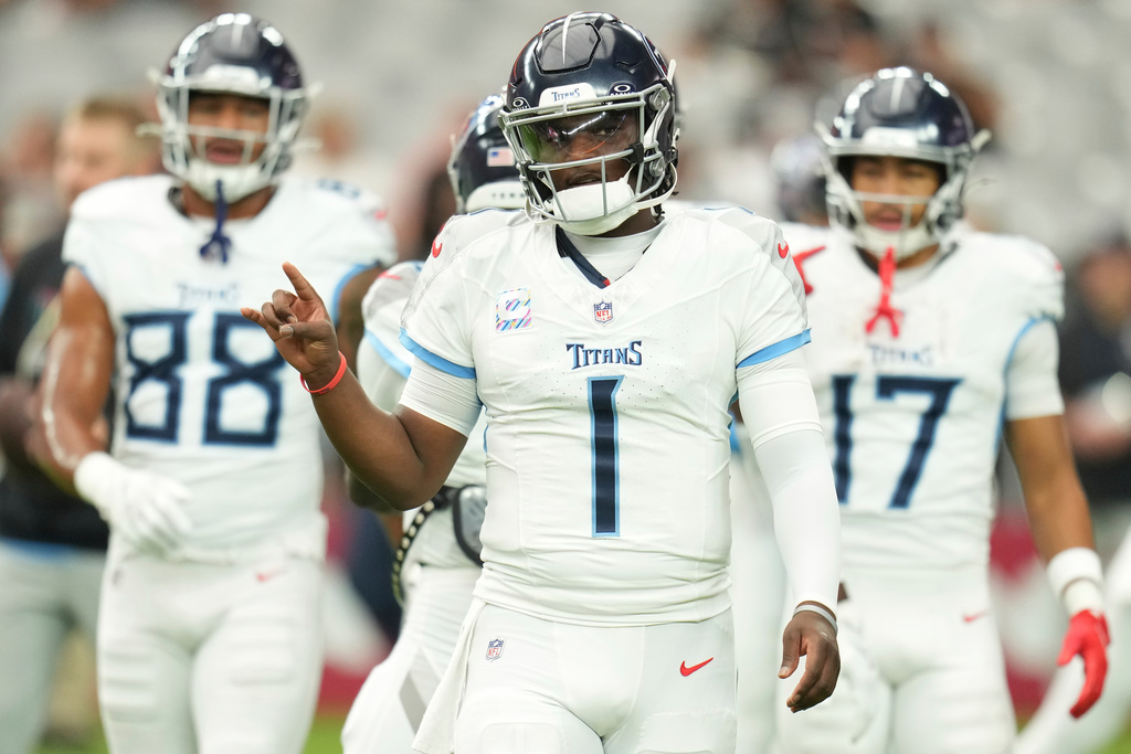 Tennessee Titans quarterback Cam Ward (1) warms up before an NFL football game against the Arizona Cardinals, Sunday, Oct. 5, 2025, in Glendale, Ariz. (AP Photo/Rick Scuteri)