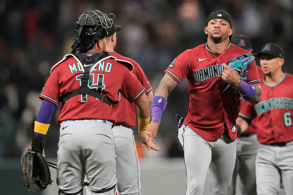 Arizona Diamondbacks' Gabriel Moreno, left, celebrates with Ketel Marte after a baseball game against the San Francisco Giants Tuesday, May 26, 2026, in San Francisco. (AP Photo/Jeff Chiu)