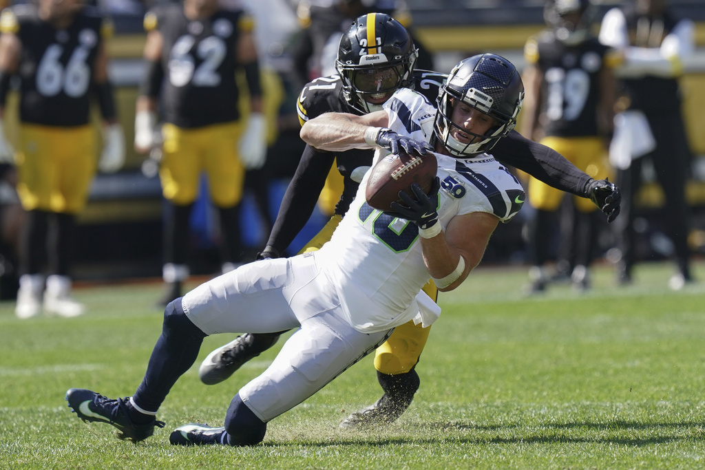 Seattle Seahawks wide receiver Cooper Kupp (10) pulls in a pass as Pittsburgh Steelers safety Chuck Clark (21) defends during the second half of an NFL football game Sunday, Sept. 14, 2025, in Pittsburgh. (AP Photo/Matt Freed)