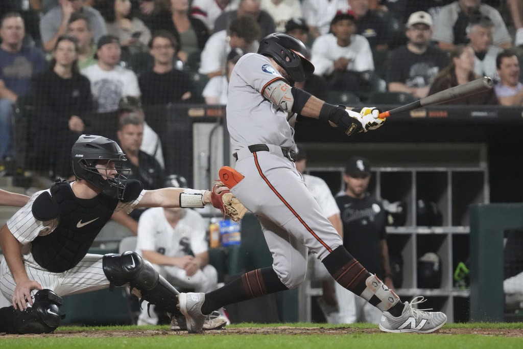 Baltimore Orioles' Colton Cowser hits a three-run home run during the sixth inning of a baseball game against the Chicago White Sox in Chicago, Monday, Sept. 15, 2025. (AP Photo/Nam Y. Huh)