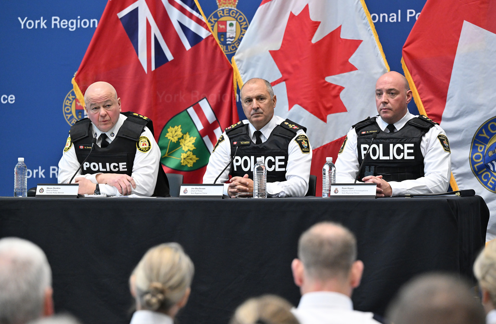 Toronto police service chief Myron Demkiw, left, is joined by York regional police chief Jim MacSween, center, and YRP deputy chief Ryan Hogan at a news conference to announce the results of 'Project South,' a lengthy investigation into organized crime and corruption at York Regional police headquarters in Aurora, Ont. on Thursday, Feb. 5, 2026. (Jon Blacker /The Canadian Press via AP)