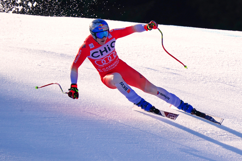 Switzerland's Marco Odermatt speeds down the course, during a men's World Cup downhill race, in Garmisch Partenkirchen, Germany, Saturday, Feb. 28, 2026. (AP Photo/Pier Marco Tacca)