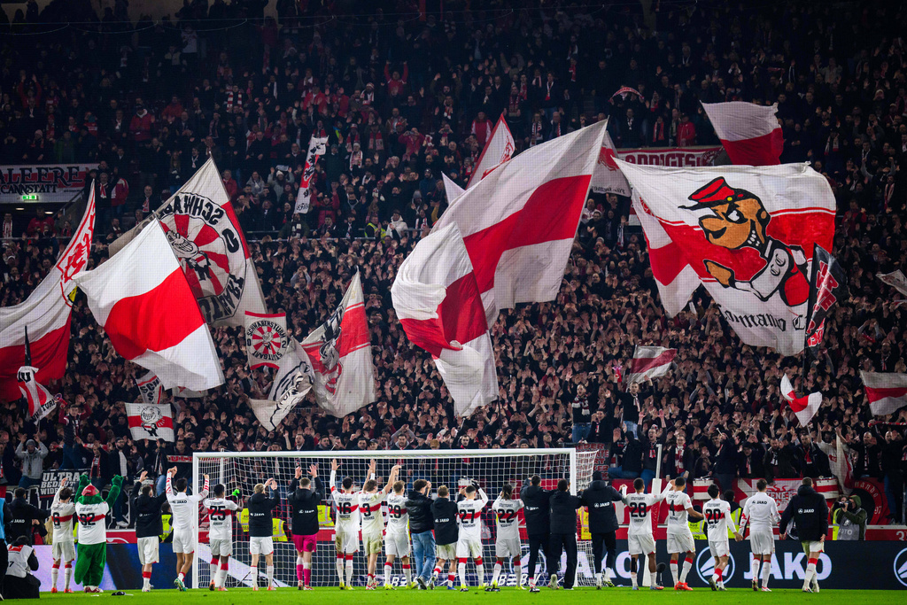 Stuttgart players celebrate with their fans after the Bundesliga soccer match between VfB Stuttgart and Eintracht Frankfurt in Stuttgart, Germany, Tuesday Jan. 13, 2026. (Tom Weller/dpa via AP)
