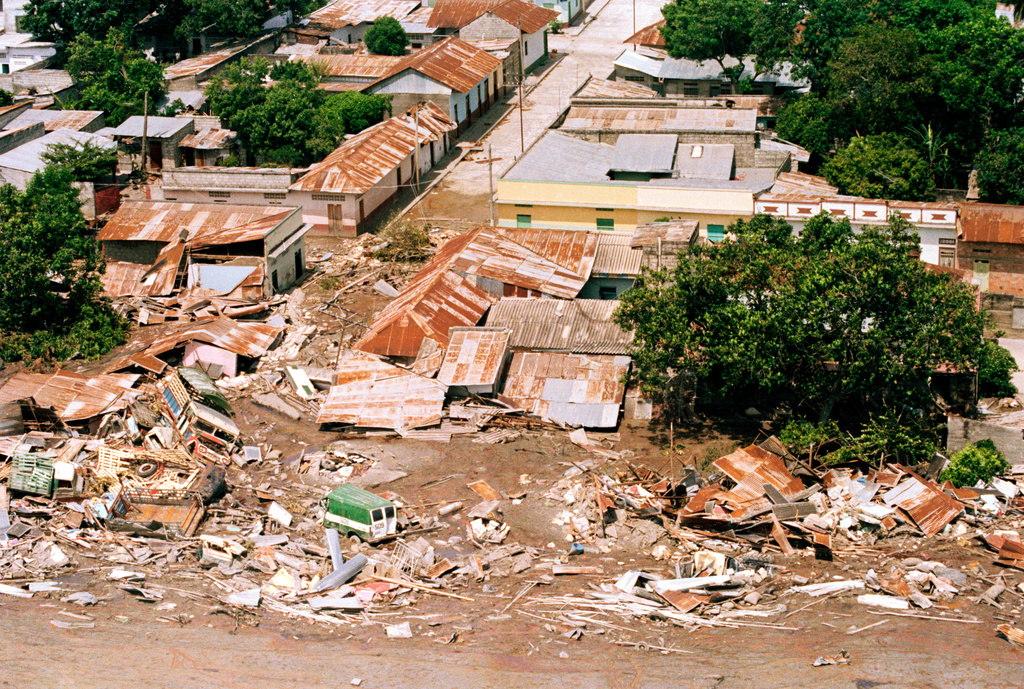FILE - Aerial view shows destruction of mud flow in Armero, Colombia in the aftermath of the volcanic eruption of Nevado del Ruiz, Nov. 18, 1985. (AP Photo/Carlos Osorio, File)