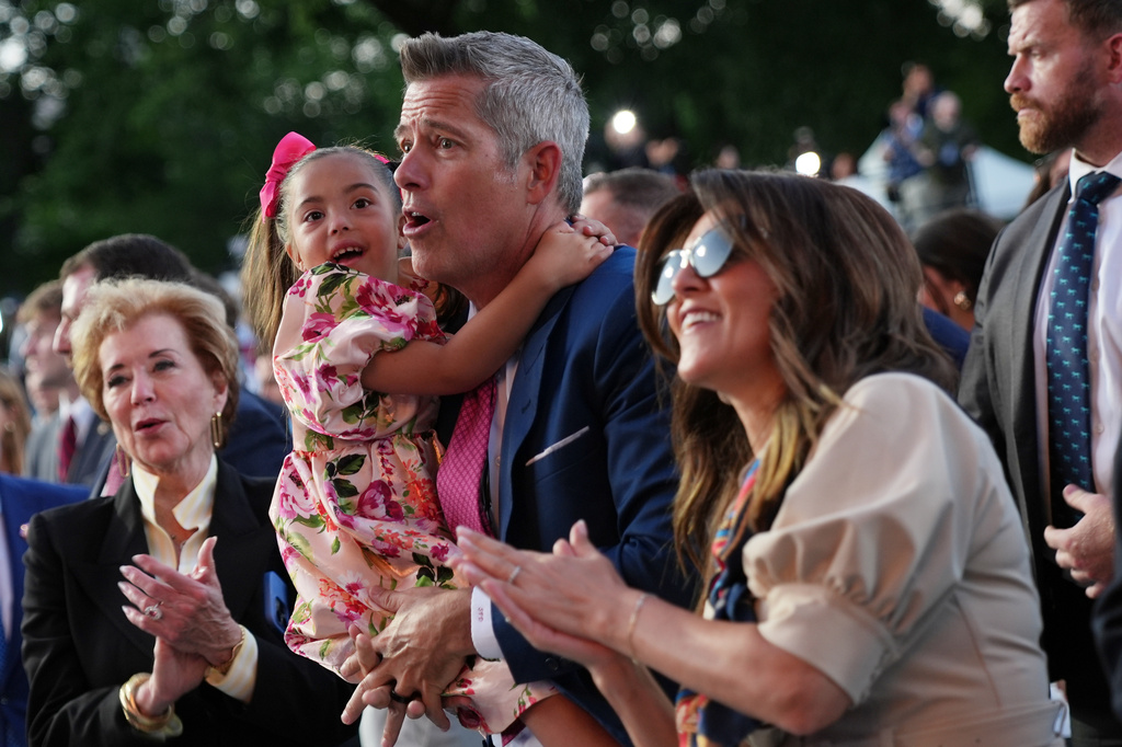 Transportation Secretary Sean Duffy and his family, listen to speakers at the opening of the Great American State Fair, Wednesday, June 24, 2026, in Washington, as Education Secretary Linda McMahon, looks on, left. (AP Photo/Jacquelyn Martin)