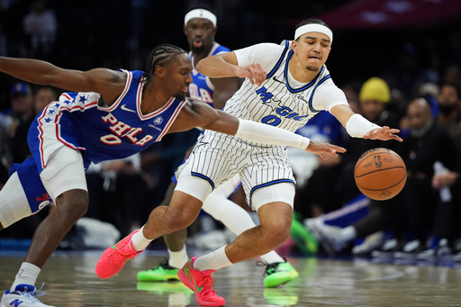 Orlando Magic's Anthony Black, right, and Philadelphia 76ers' Tyrese Maxey chase a loose bal lduring the first half of an NBA basketball game Monday, Oct. 27, 2025, in Philadelphia. (AP Photo/Matt Slocum) Orlando Magic's Anthony Black, right, and Philadelphia 76ers' Tyrese Maxey chase a loose bal lduring the first half of an NBA basketball game Monday, Oct. 27, 2025, in Philadelphia. (AP Photo/Matt Slocum)