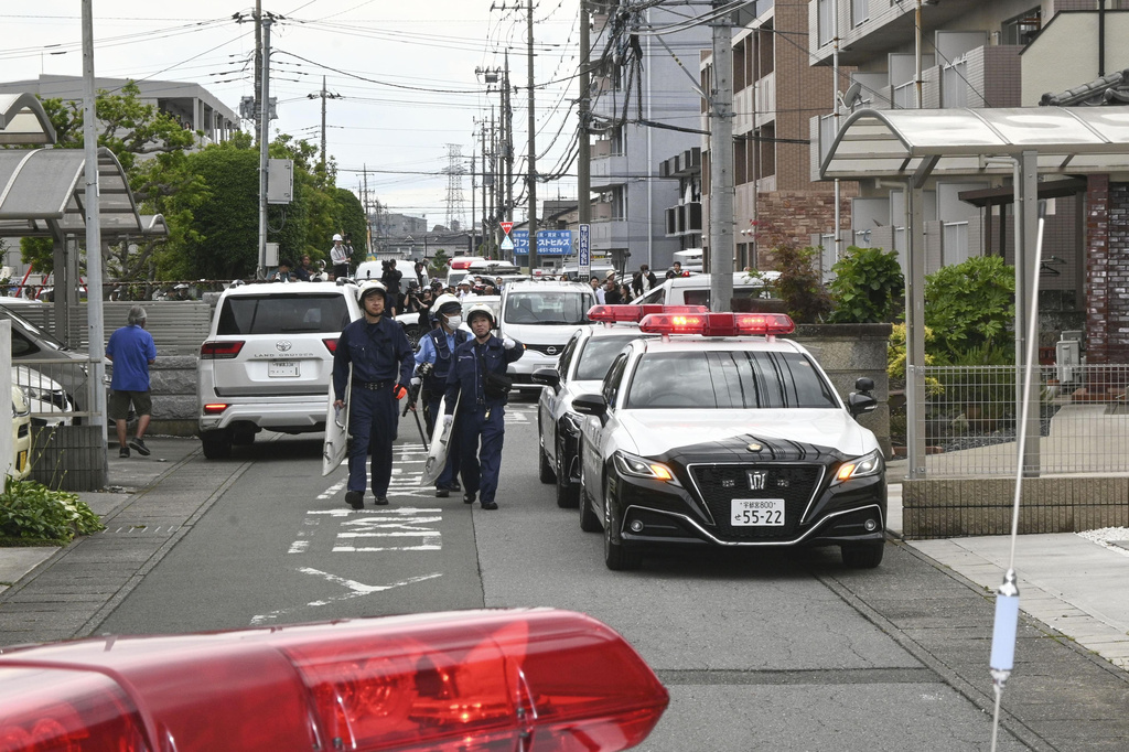 Police are seen at a residential area where a bear showed up in Utsunomiya, north of Tokyo Tuesday, June 9, 2026. (Kyodo News via AP)