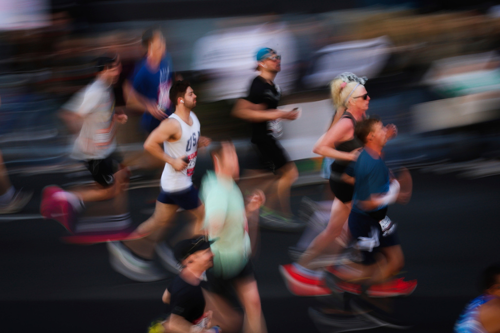FILE - Runners make their way through Brooklyn during the New York City Marathon, Nov. 3, 2024, in New York. (AP Photo/Heather Khalifa, File)