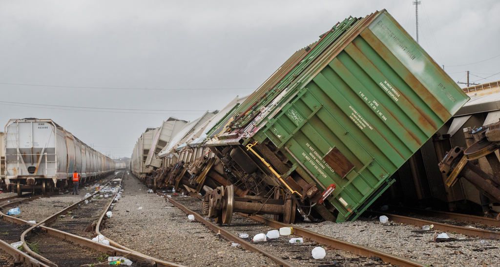 Rail cars sit derailed at the CPKC New Orleans Yard in Metairie, La., Thursday, June 18, 2026, after winds from Tropical Storm Arthur moved through the area. (David Grunfeld/The Times-Picayune/The New Orleans Advocate via AP)