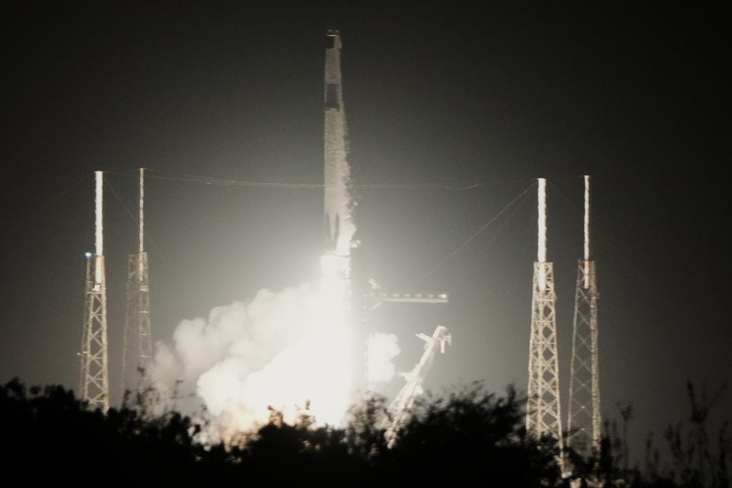 A SpaceX Falcon 9 rocket with a crew of four aboard the Dragon space craft lifts off from pad 40 at the Cape Canaveral Space Force Station in Cape Canaveral, Fla., Friday, Feb. 13, 2026. (AP Photo/John Raoux)