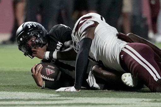 Texas A&M quarterback Marcel Reed (10) looks up from the end zone after scoring a touchdown and begin tackled by Mississippi State cornerback Kelley Jones (1) during the second half of an NCAA college football game Saturday, Oct. 4, 2025, in College Station, Texas. (AP Photo/Sam Craft) Texas A&M quarterback Marcel Reed (10) looks up from the end zone after scoring a touchdown and begin tackled by Mississippi State cornerback Kelley Jones (1) during the second half of an NCAA college football game Saturday, Oct. 4, 2025, in College Station, Texas. (AP Photo/Sam Craft)