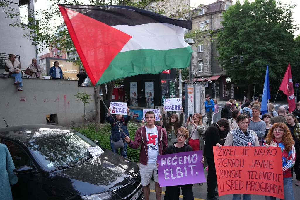 People attend a rally against Israel's participation in the Eurovision Song Contest in front of the state-run TV headquarters in Belgrade, Serbia, Tuesday, April 28, 2026. (AP Photo/Darko Vojinovic)