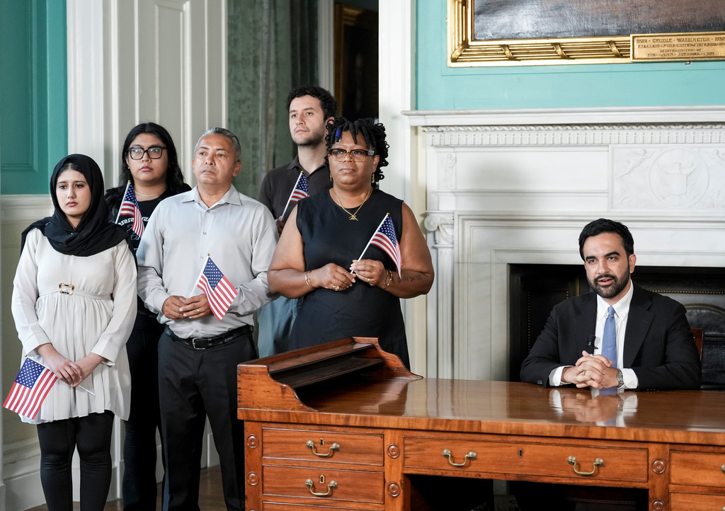 Mayor Zohran Mamdani delivers an address from George Washington's desk, surrounded by recently naturalized citizens, to commemorate America's 250th anniversary on Friday, July 3, 2026, in New York. (Anna Connors /The New York Times via AP, Pool)