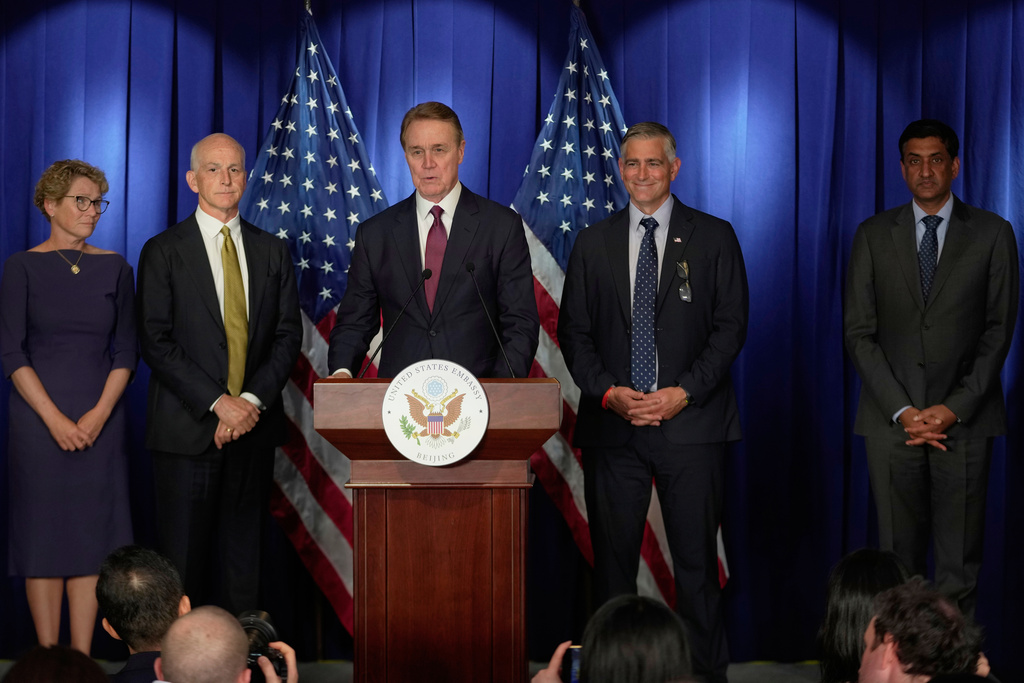 U.S. Ambassador to China David Perdue, center, speaks at a press conference with a bipartisan group of U.S. lawmakers from left, Chrissy Houlahan, Democratic member of House Armed Services Committee, U.S. Rep. Adam Smith, D-Wash, Michael Baumgartner, Republican member of House Foreign Affairs Committee, and Ro Khanna, Democratic member of House Armed Services Committee, at the U.S. Embassy in Beijing, China, Tuesday, Sept. 23, 2025. (AP Photo/Mahesh Kumar A.)