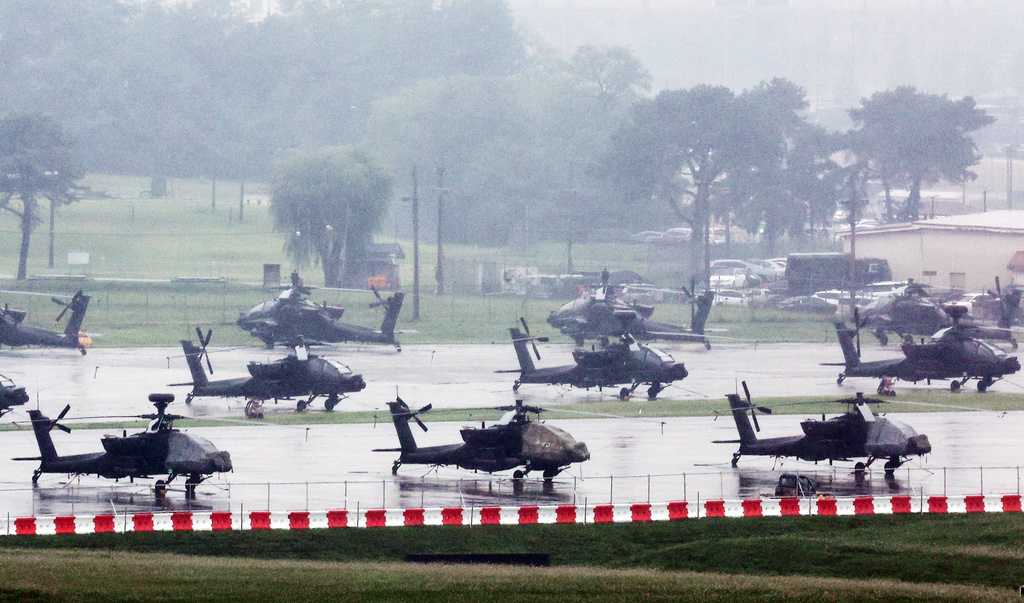 U.S. Apache helicopters are parked at Camp Humphreys in Pyeongtaek, South Korea, Friday, Aug. 21, 2026. (Hong Ki-won/Yonhap via AP)
