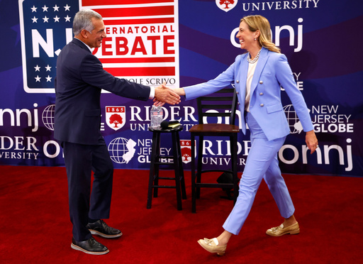 FILE - Republican candidate Jack Ciattarelli, left, shake hands with Democratic candidate for governor Mikie Sherrill, right, before a gubernatorial debate Sept. 21, 2025, in Lawrenceville, N.J. (AP Photo/Noah K. Murray, File) FILE - Republican candidate Jack Ciattarelli, left, shake hands with Democratic candidate for governor Mikie Sherrill, right, before a gubernatorial debate Sept. 21, 2025, in Lawrenceville, N.J. (AP Photo/Noah K. Murray, File)