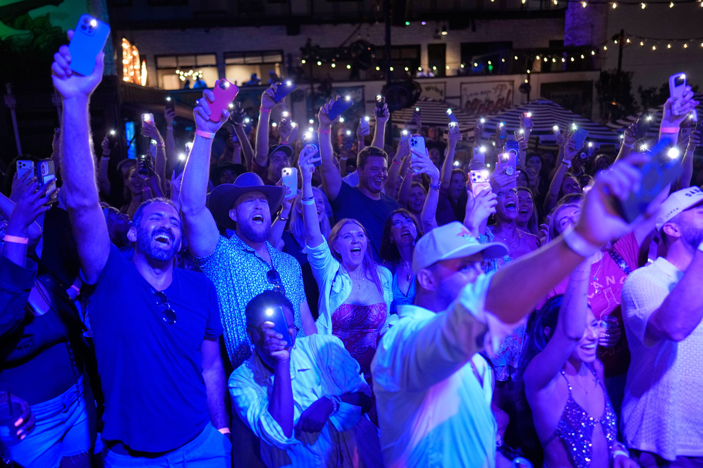 Attendees cheer during a Tall Tour event Saturday, May 9, 2026, in Austin, Texas. (AP Photo/David J. Phillip)