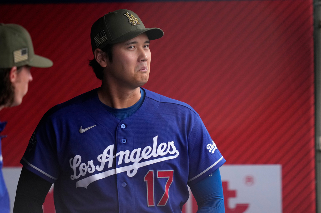 Los Angeles Dodgers' Shohei Ohtani stands in the dugout prior to a baseball game against the Los Angeles Angels, Saturday, May 16, 2026, in Anaheim, Calif. (AP Photo/Mark J. Terrill)