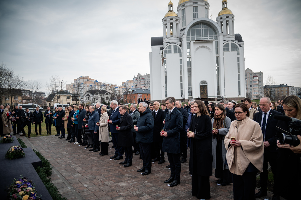 In this photo provided by the Ukrainian Foreign Ministry Press Office, High Representative of the European Union for Foreign Affairs and Security Policy Kaja Kallas, center left, Ukraine's Foreign Minister Andrii Sybiha, center right, and EU foreign ministers attend a commemorating ceremony in Bucha, Ukraine, Tuesday, March 31, 2026. (Ukrainian Foreign Ministry Press Office via AP)