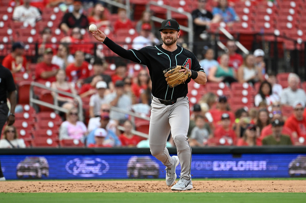 Arizona Diamondbacks third baseman Tim Tawa throws out St. Louis Cardinals' Jordan Walker at first base in the fifth inning of a baseball game, Thursday, July 23, 2026, in St. Louis. (AP Photo/Joe Puetz)