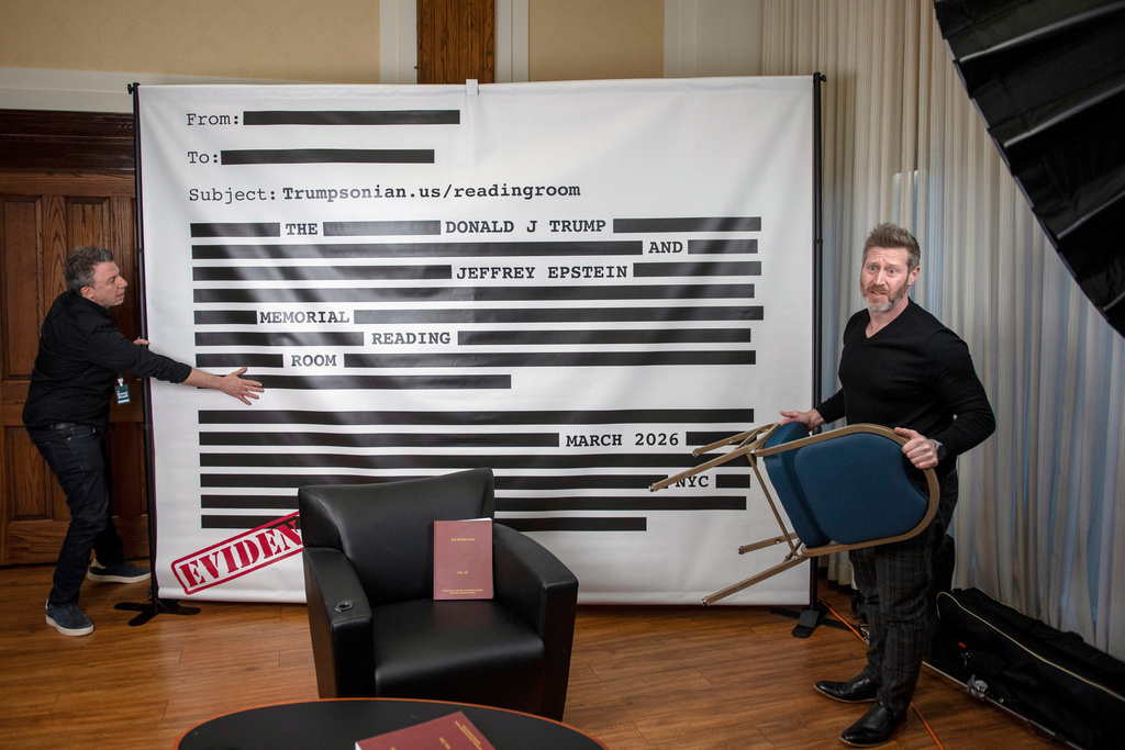 An "Epstein Reading Room" studio backdrop is set up at a rebuttal to President Donald Trump's State of the Union hosted by Defiance.org, the Portland Frog Brigade and COURIER at the National Press Club in Washington, Tuesday, Feb. 24, 2026. (AP Photo/Cliff Owen)