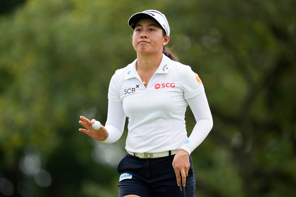 Jeeno Thitikul, of Thailand, waves after making a putt on the 13th hole during the second round of the Chevron Championship LPGA golf tournament Friday, April 24, 2026, in Houston. (AP Photo/Ashley Landis)