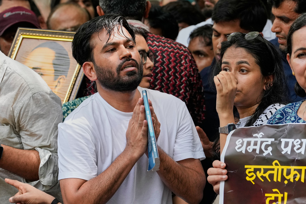 Abhijeet Dipke, center, founder of the Cockroach Janta Party gestures as he manages the crowd during a protest demonstration in New Delhi, India, Saturday, June 6, 2026. (AP Photo/Manish Swarup)