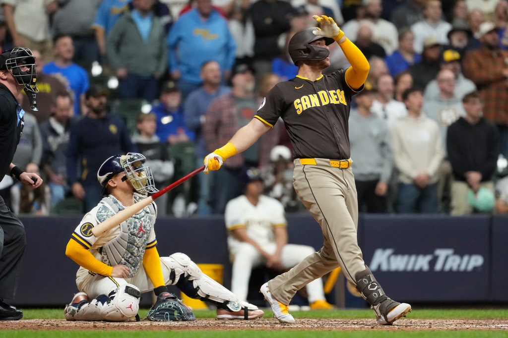 San Diego Padres' Gavin Sheets hits a three-run home run during the ninth inning of a baseball game against the Milwaukee Brewers, Wednesday, May 13, 2026, in Milwaukee. (AP Photo/Aaron Gash)