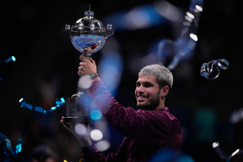 Winner Spain's Carlos Alcaraz, poses with the trophy after the men's final match against United States' Taylor Fritz at the Tokyo ATP 500 tennis tournament at Ariake Coliseum, in Tokyo, Japan, Tuesday, Sept. 30, 2025. (AP Photo/Louise Delmotte)