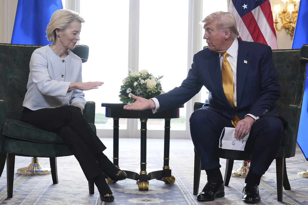 FILE- President Donald Trump and European Commission President Ursula von der Leyen shake hands after reaching a trade deal at the Trump Turnberry golf course in Turnberry, Scotland Sunday, July 27, 2025. (AP Photo/Jacquelyn Martin, File)